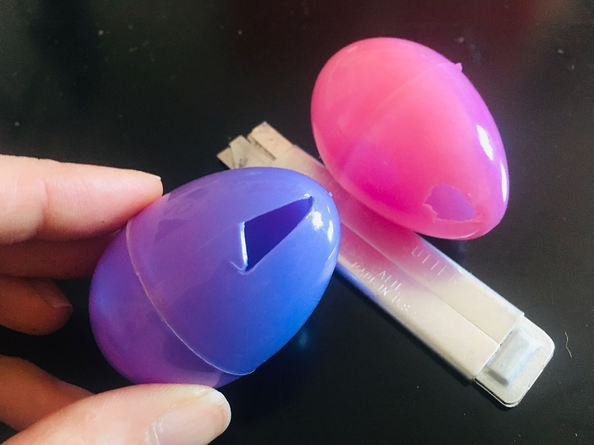 cat easter toys cut holes in plastic eggs