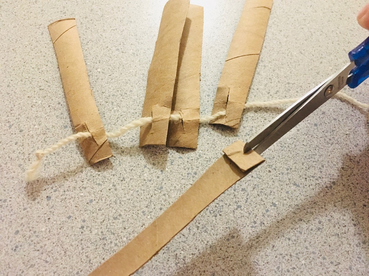 toilet paper roll toys cut strips and put on a string